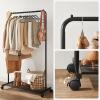 imageSONGMICS Clothes Rack with Wheels Clothing Rack for Hanging Clothes 254 mm Metal Garment Rack with Dense Mesh Storage Shelf 110 lb Load Capacity 2 Brakes Black UHSR25BKBlack
