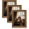 imageSONGMICS 5x7 Picture Frames with 6 Mats for Wall Set of 3 Collage Photo Frames for 5x7 4x6 35x5 Pictures Hanging or Table Display Glass Front 5 NonTrace Nails Teak Brown URPF045K01Teak Brown
