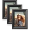 imageSONGMICS 5x7 Picture Frames with 6 Mats for Wall Set of 3 Collage Photo Frames for 5x7 4x6 35x5 Pictures Hanging or Table Display Glass Front 5 NonTrace Nails Teak Brown URPF045K01Ash Black