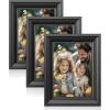 imageSONGMICS 5x7 Picture Frames with 6 Mats for Wall Set of 3 Collage Photo Frames for 5x7 4x6 35x5 Pictures Hanging or Table Display Glass Front 5 NonTrace Nails Teak Brown URPF045K01Ash Black