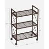 imageSONGMICS 3Tier Metal Storage Rack with Wheels Mesh Shelving Unit with X Side Frames 236Inch Width for Entryway Kitchen Living Room Bathroom Industrial Style Metallic Gold UBSC163A02Metallic Bronze