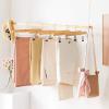 imageSONGMICS Wooden Pants Hangers 12 Pack Pants Hangers with Clips Adjustable AntiRust Metal Clips 360 Swivel Hook Skirt Hangers for Pant Skirts Natural Grain UCRW00812With Adjustable Clips