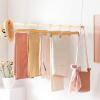 imageSONGMICS Wooden Pants Hangers 12 Pack Pants Hangers with Clips Adjustable AntiRust Metal Clips 360 Swivel Hook Skirt Hangers for Pant Skirts Natural Grain UCRW00812With Clips
